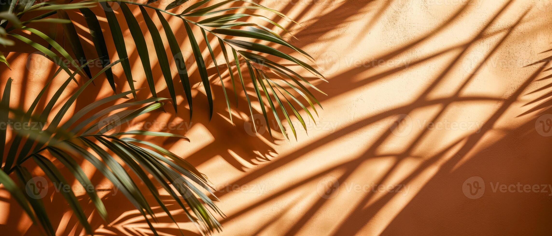 AI generated The interplay of light and shadow from tropical palm leaves creates an artistic pattern on a warm, textured wall photo