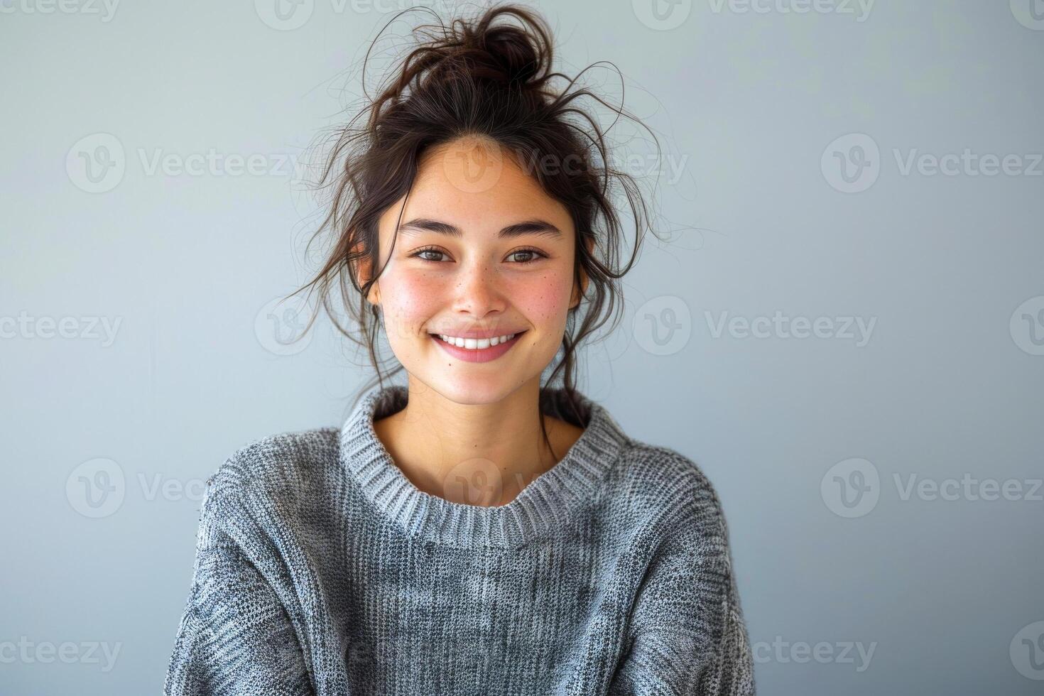 AI generated Person with a warm smile wearing a casual grey sweater against a plain background photo