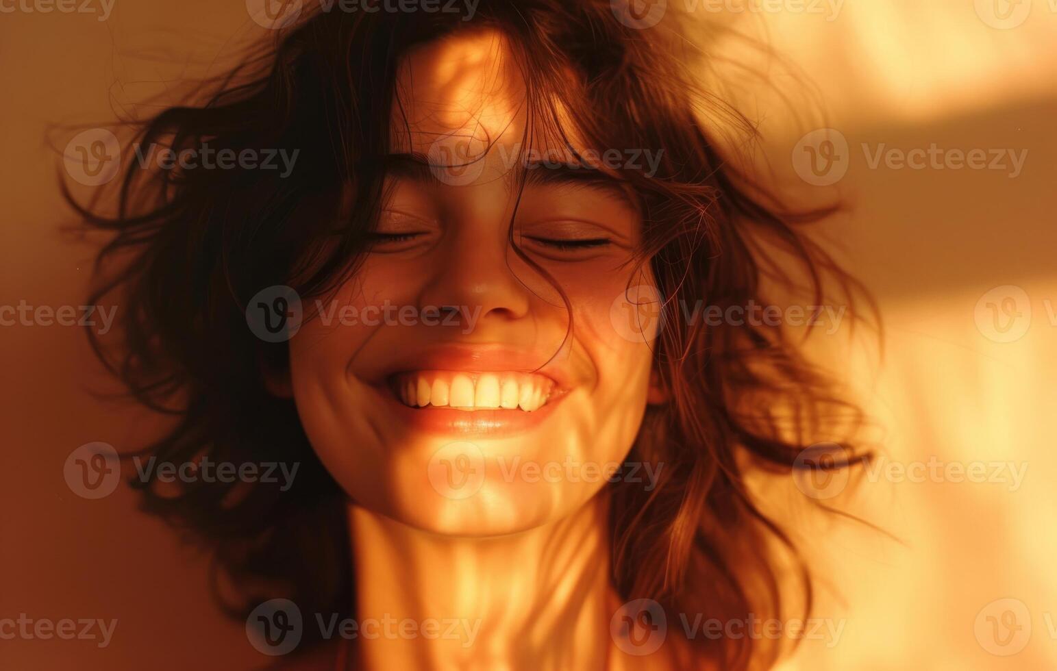 Warm Sunset Glow on Happy Young Woman's Fac photo