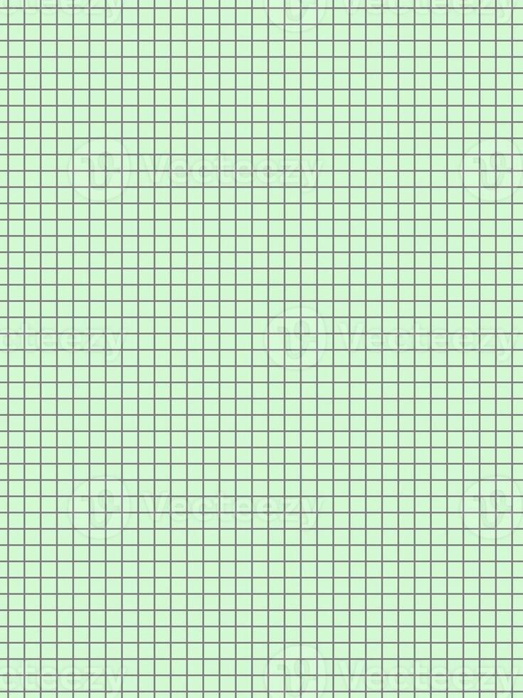 black color graph paper over green background photo