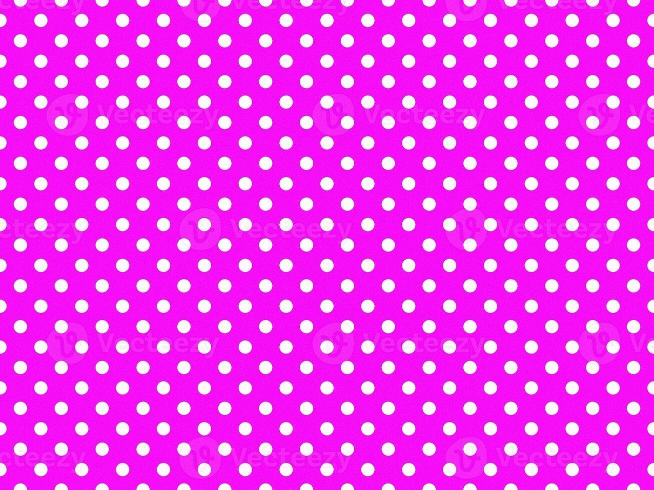 texturised white color polka dots over fuchsia purple background photo