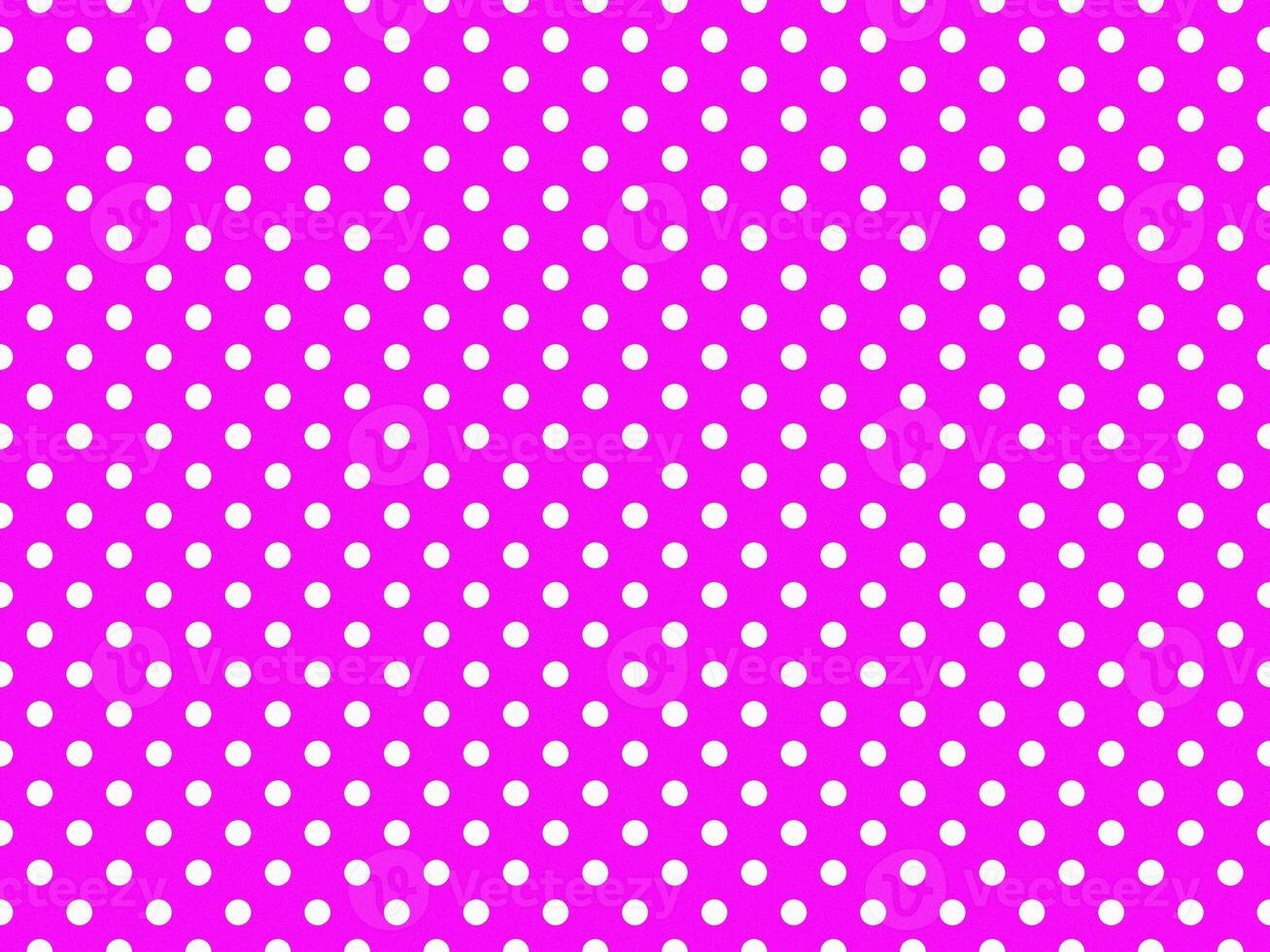 texturised white color polka dots over fuchsia purple background photo