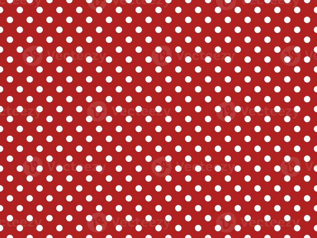 texturised white color polka dots over firebrick red background photo