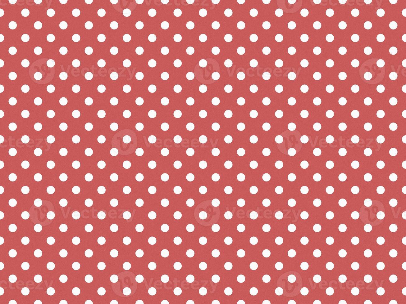 texturised white color polka dots over indian red background photo