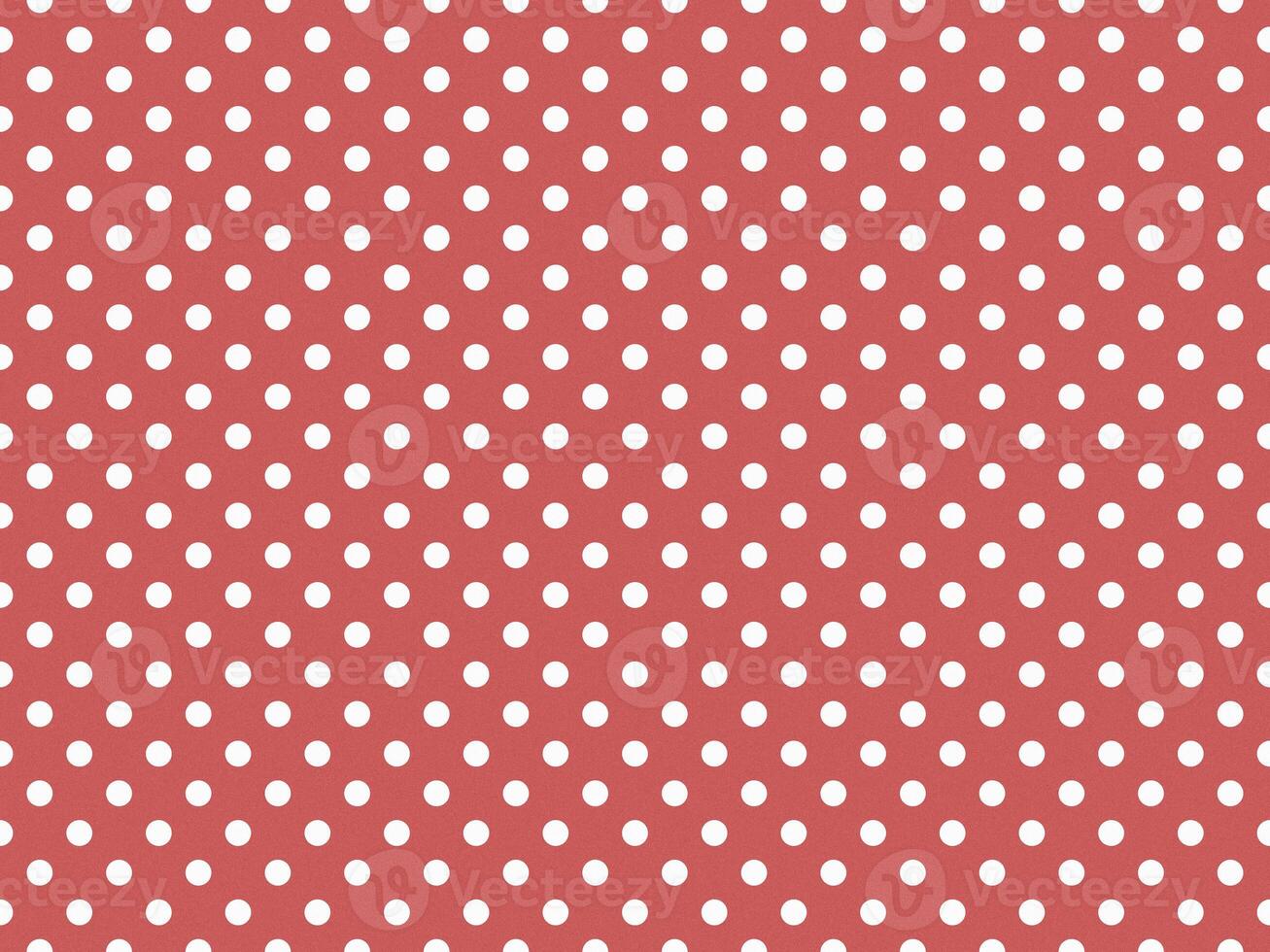 texturised white color polka dots over indian red background photo