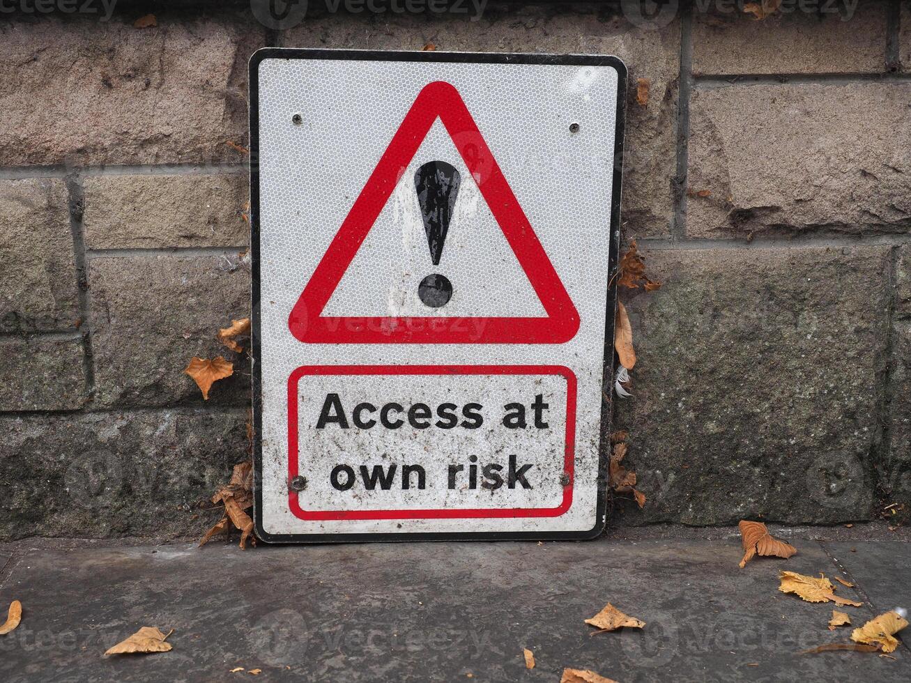 access at own risk sign photo