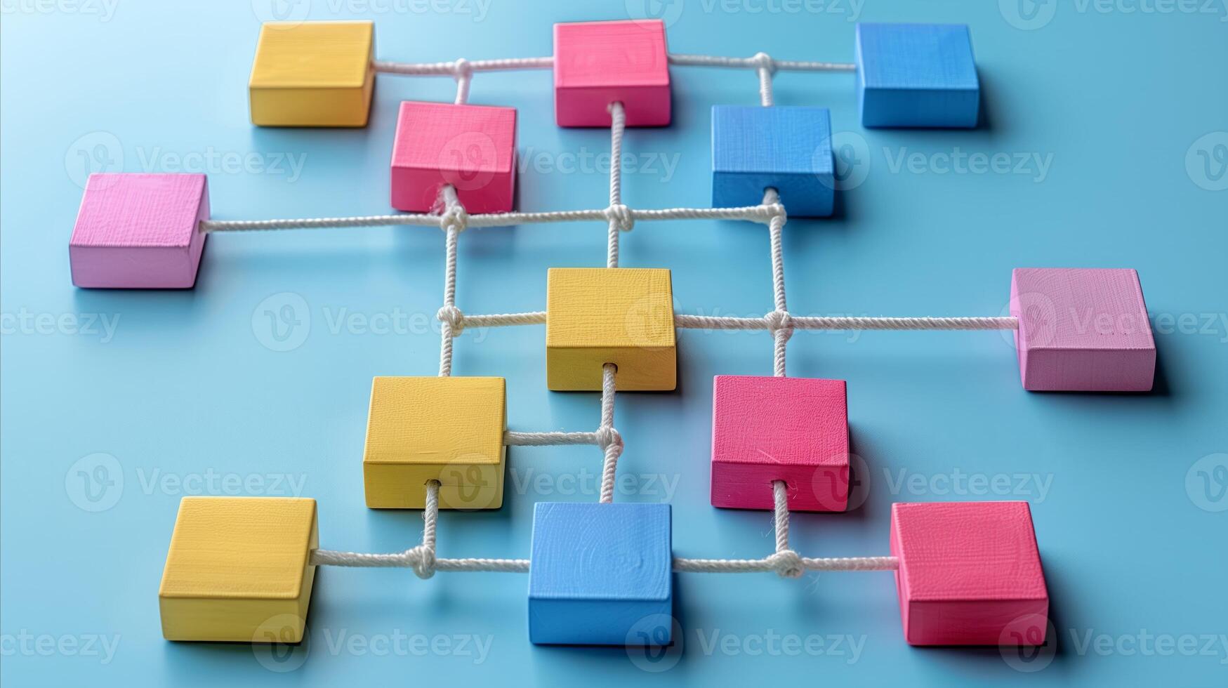 Colorful Wooden Blocks Connected by Strings on Blue Background photo