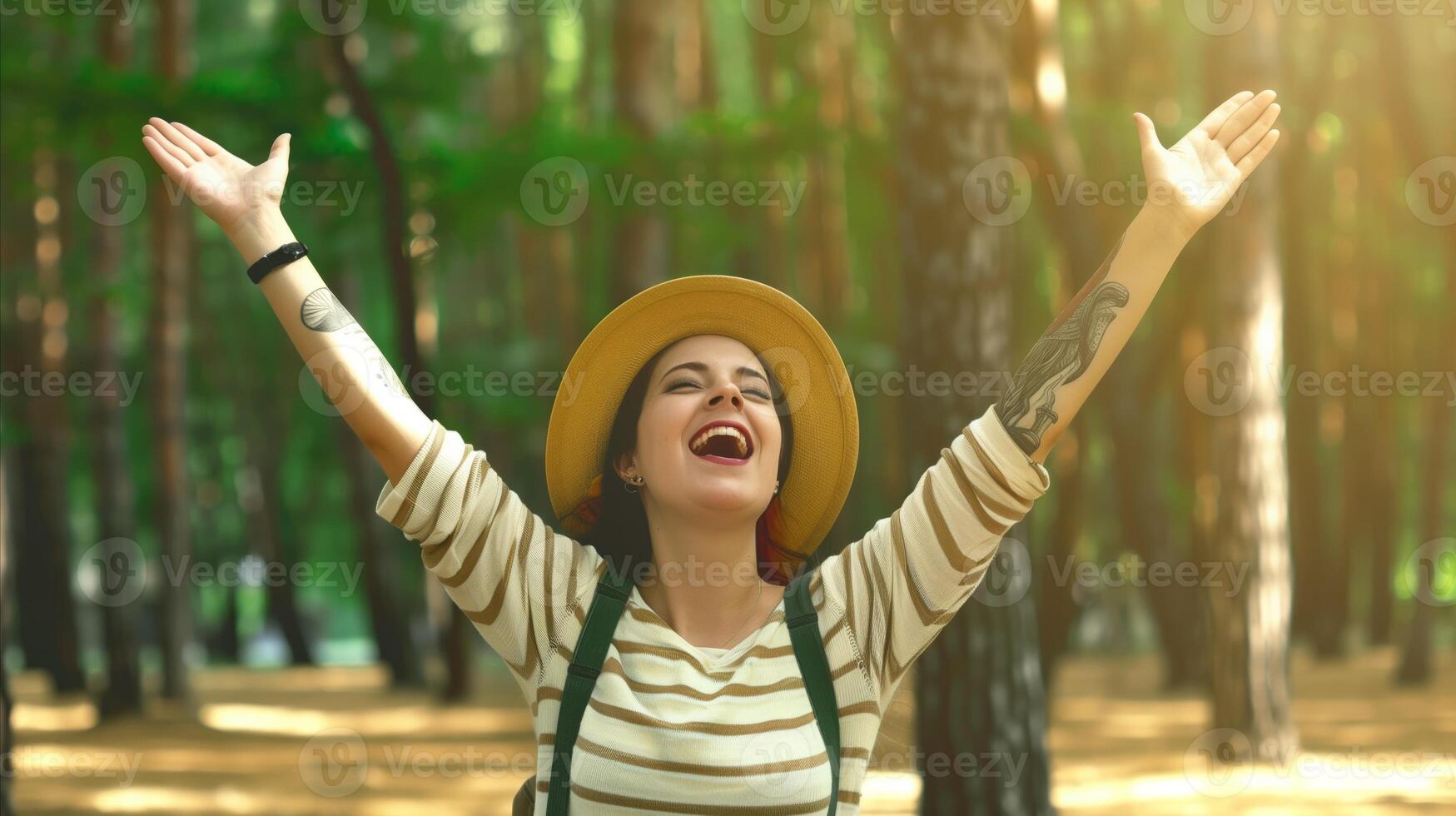 Joyful Woman Embracing Nature in Sunlit Forest photo