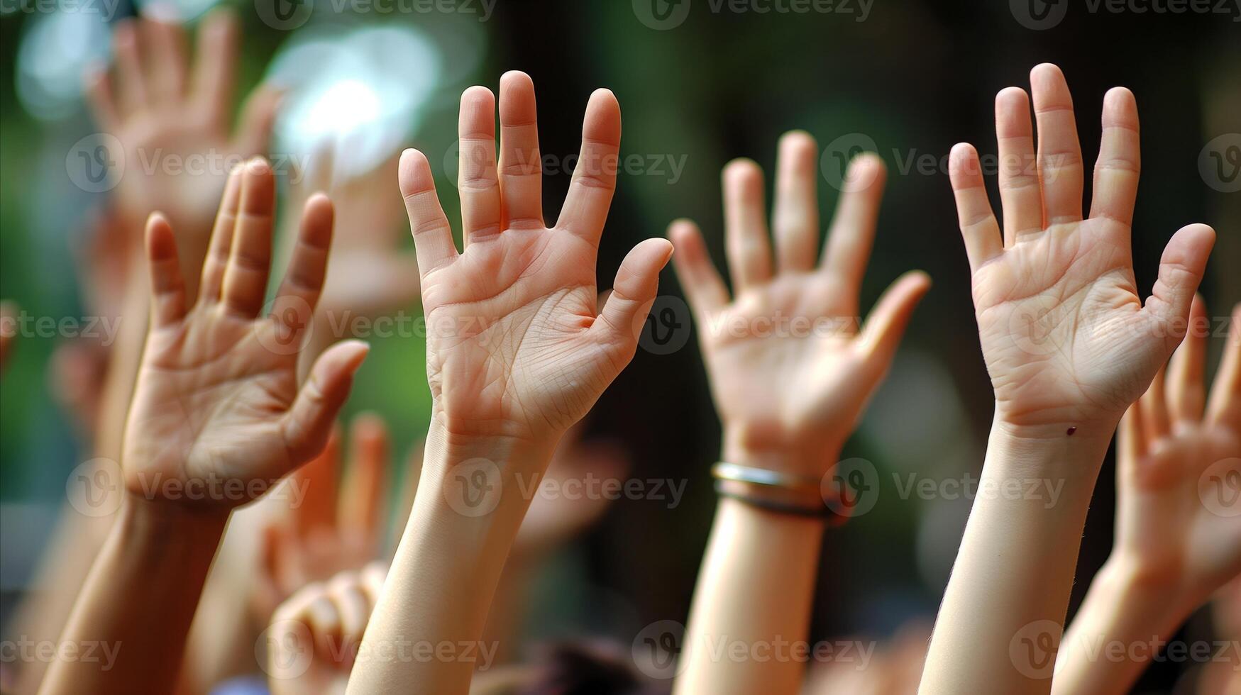 Raised Hands in a Group Setting During Daytime photo