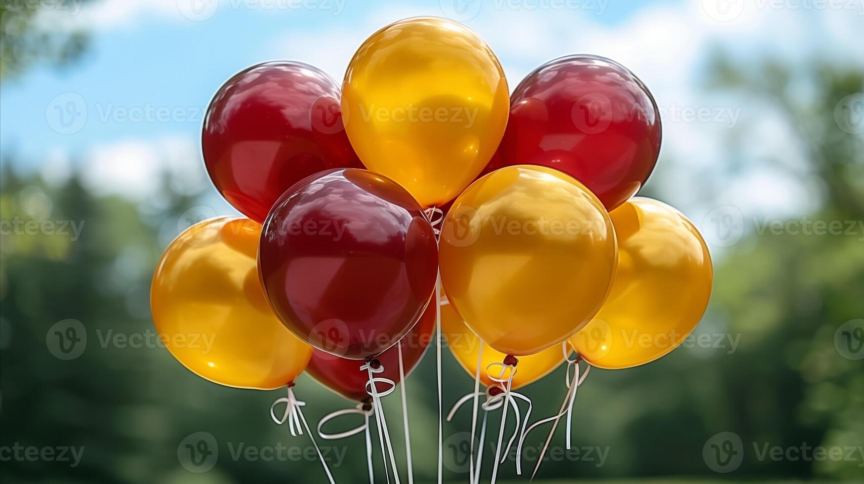 Vibrant Red and Yellow Balloons Against a Cloudy Sky photo