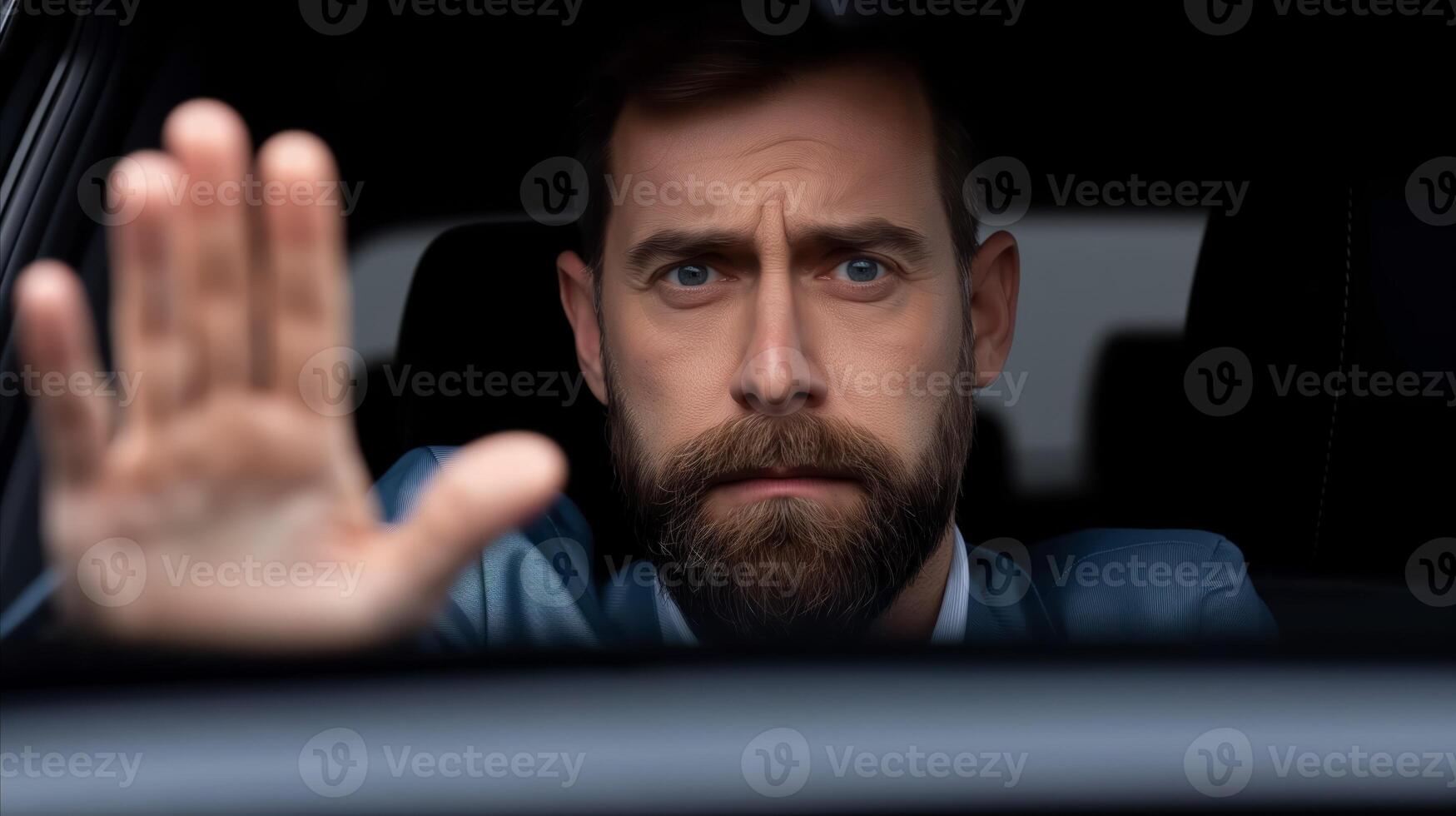 Man Gesturing Stop From Car at Night photo