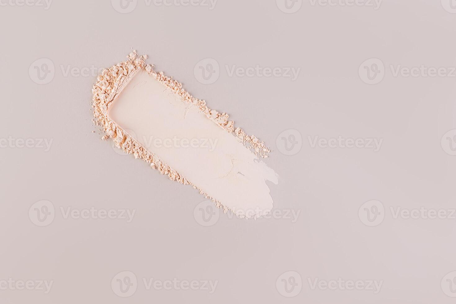 Loose powder swatch for face makeup. Universal tone. Light and delicate powder structure. Pastel background. A copy space. layout. mockup. photo