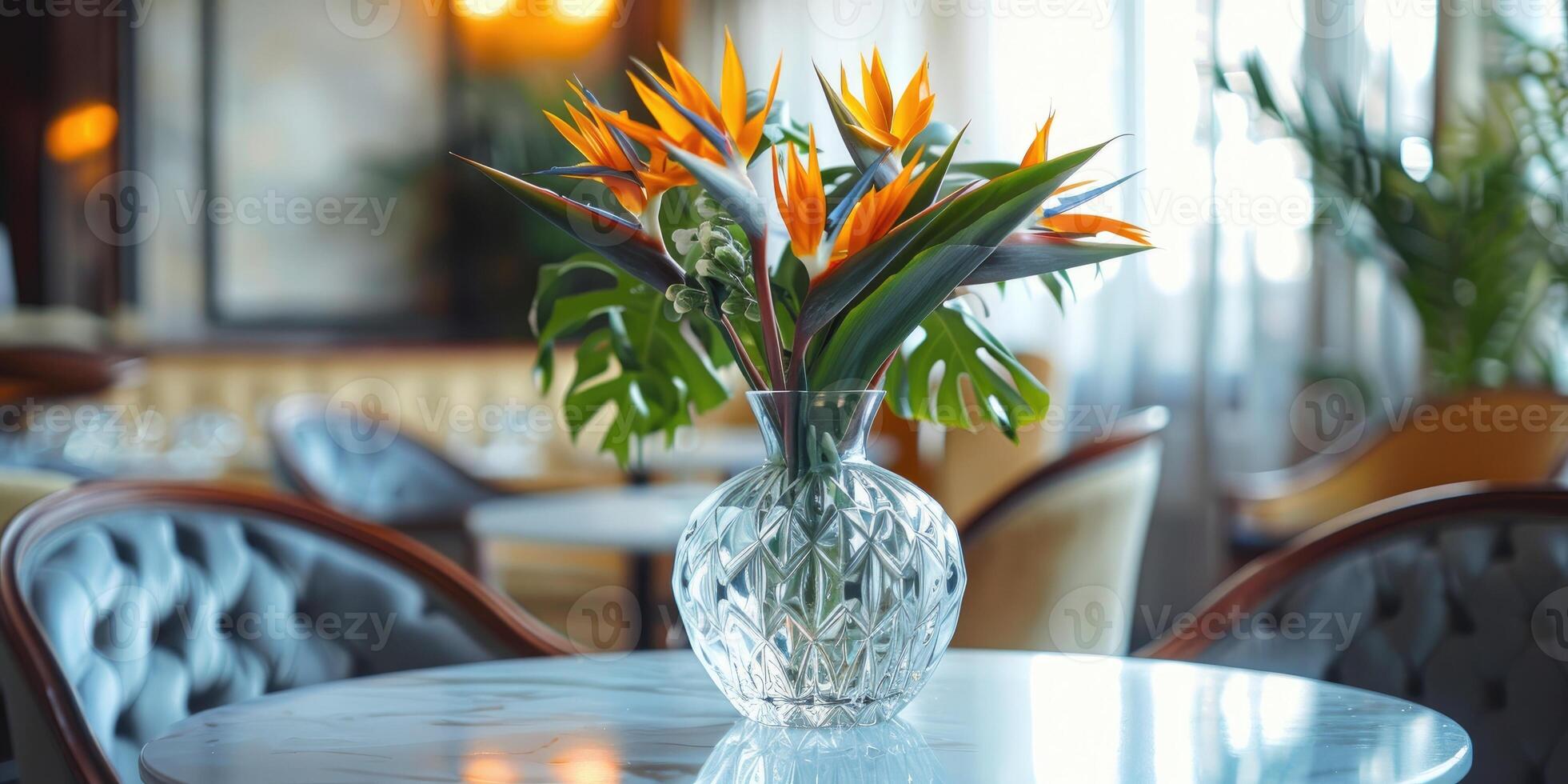 Beautiful bird of paradise flower arrangement in a crystal vase photo