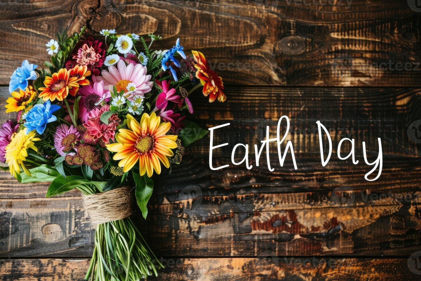Beautiful colorful flowers bouquet over rustic wood background. photo