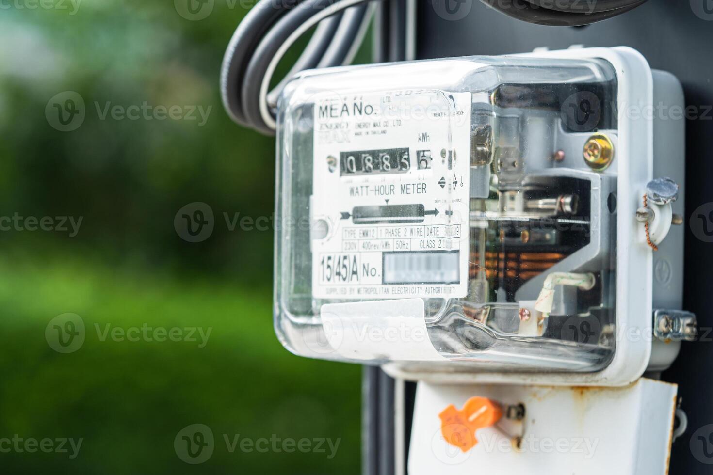 Electric measuring power meter for energy cost at home and office, solar cell concept. photo