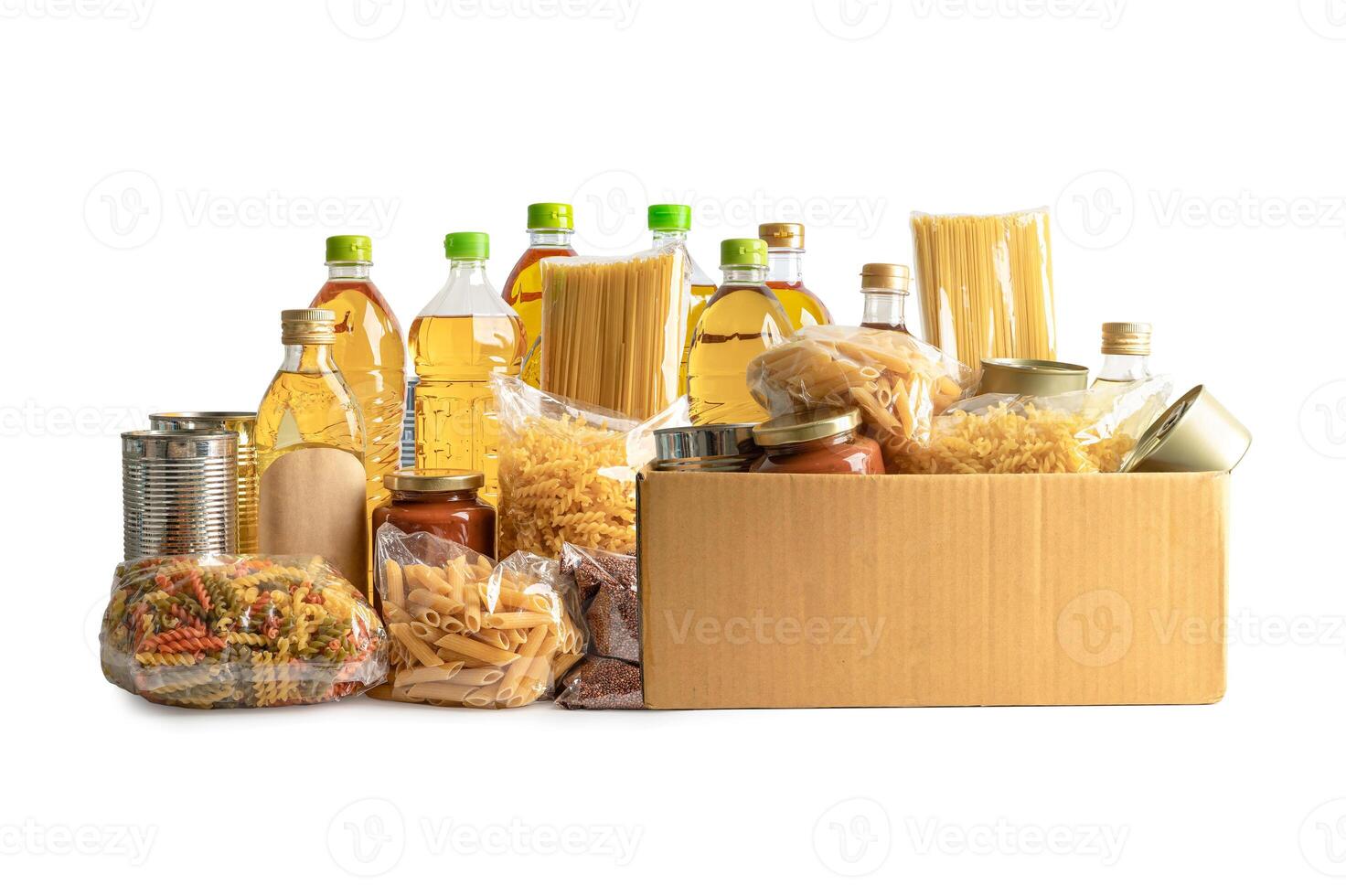 Foodstuff for donation isolated on white background, storage and delivery. Various food, pasta, cooking oil and canned food. photo