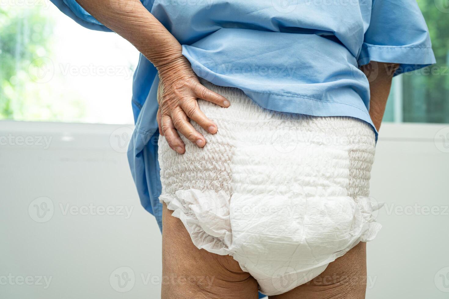 Asian senior woman patient wearing incontinence diaper in hospital, healthy strong medical. photo