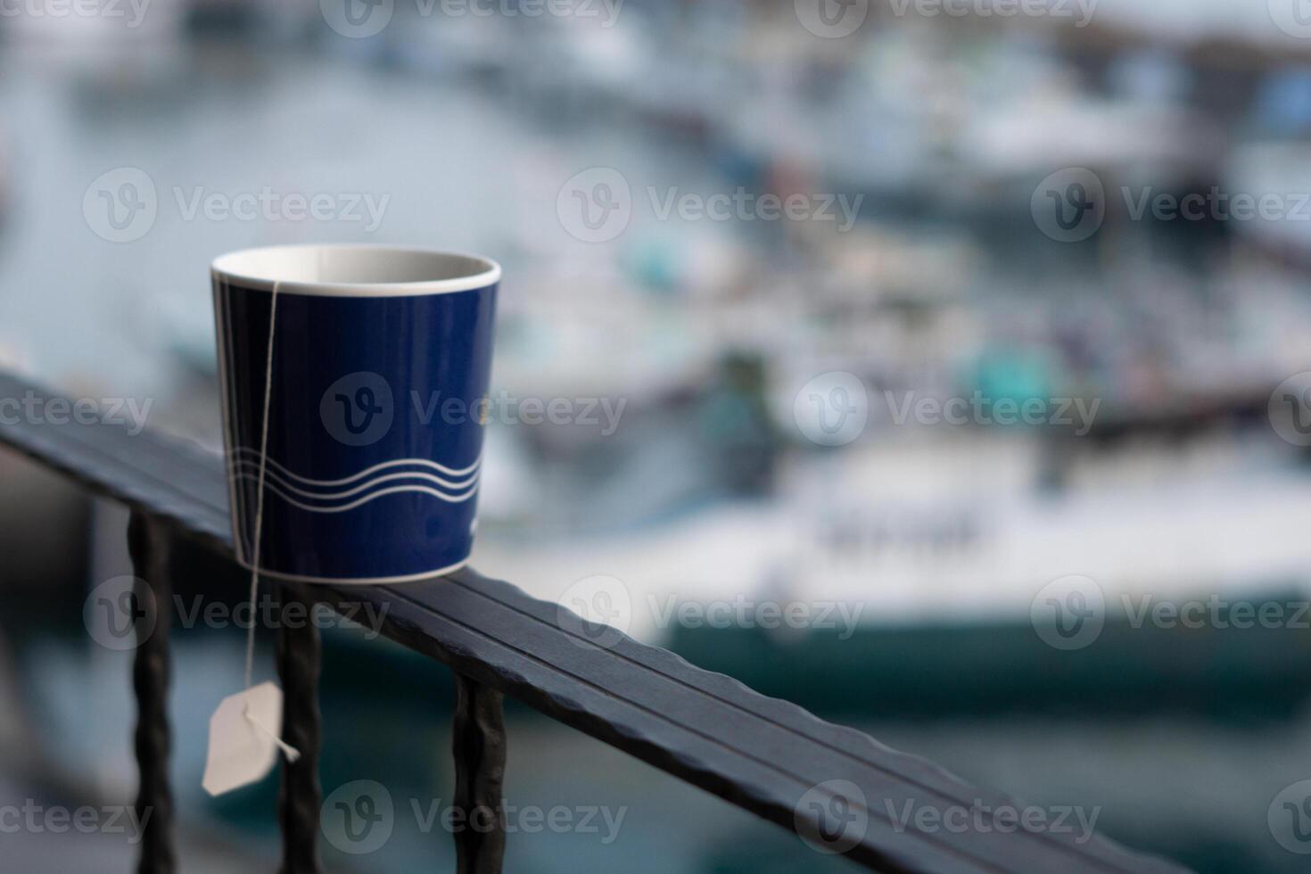 Morning Close-Up Tea in Mug, Sunrise Bokeh Overlooking Harbour Views in Taiwan photo