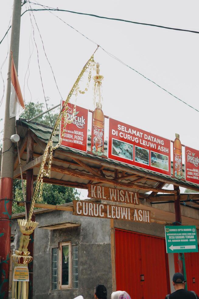 Sentul, Indonesia - 19 March 2024, A Hiking Adventure with Friends in Gunung Pancar. Stopping by local stores to buy logistics, foods and drinks. photo