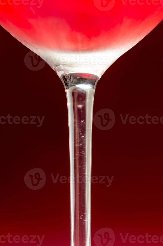 Wineglass with cold red wine photo