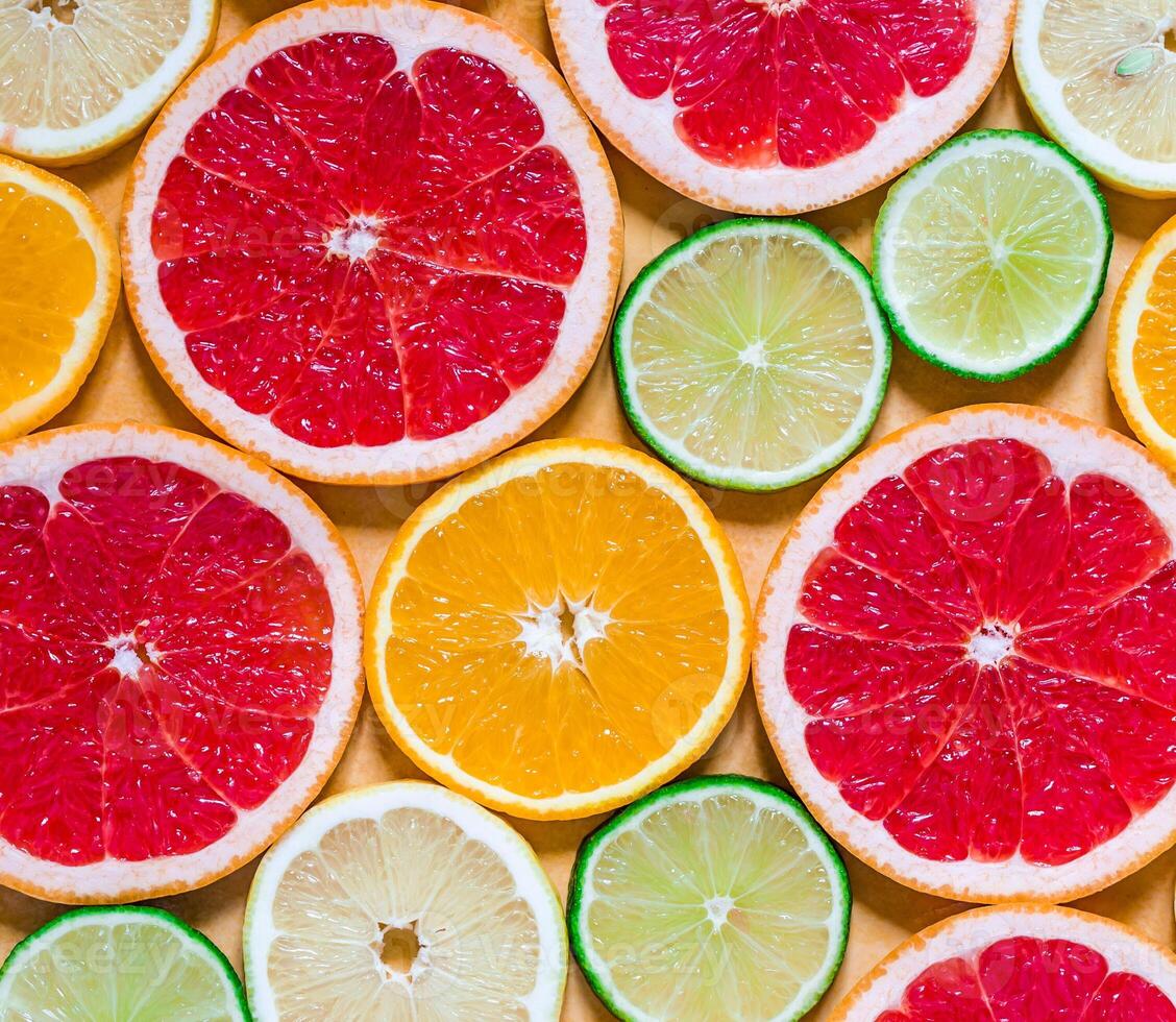 Slices of various citrus fruits photo