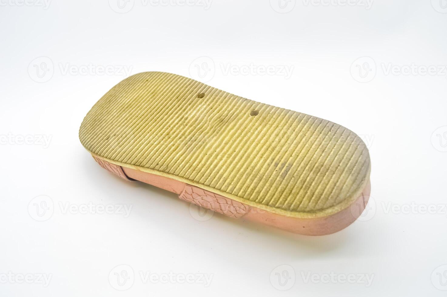 an upside down sandal showing the bottom isolated on white background photo