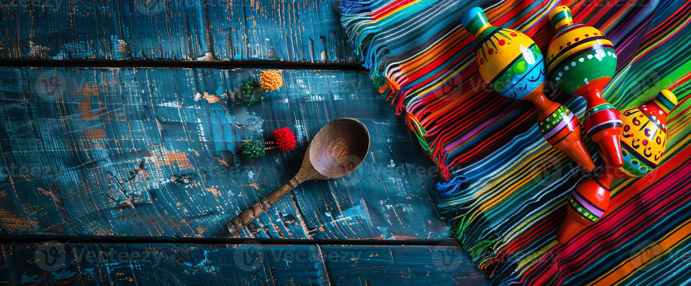 Mexico festive wooden background with sombrero, serape and maracas in flat lay view photo