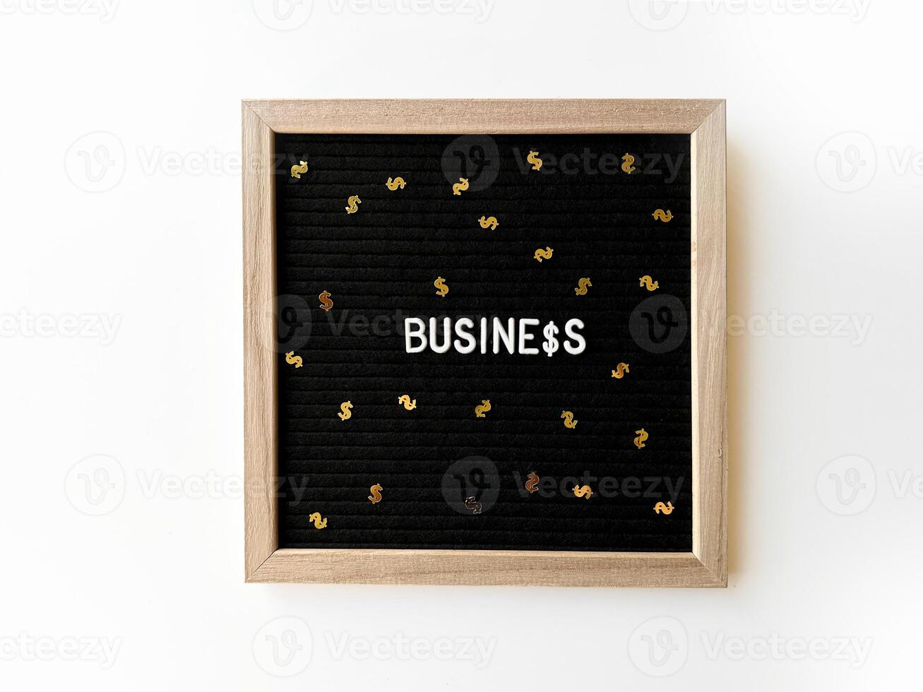 Black Letter board with spelled word Business and dollar sign confetti. Business earnings concept. Finance. photo
