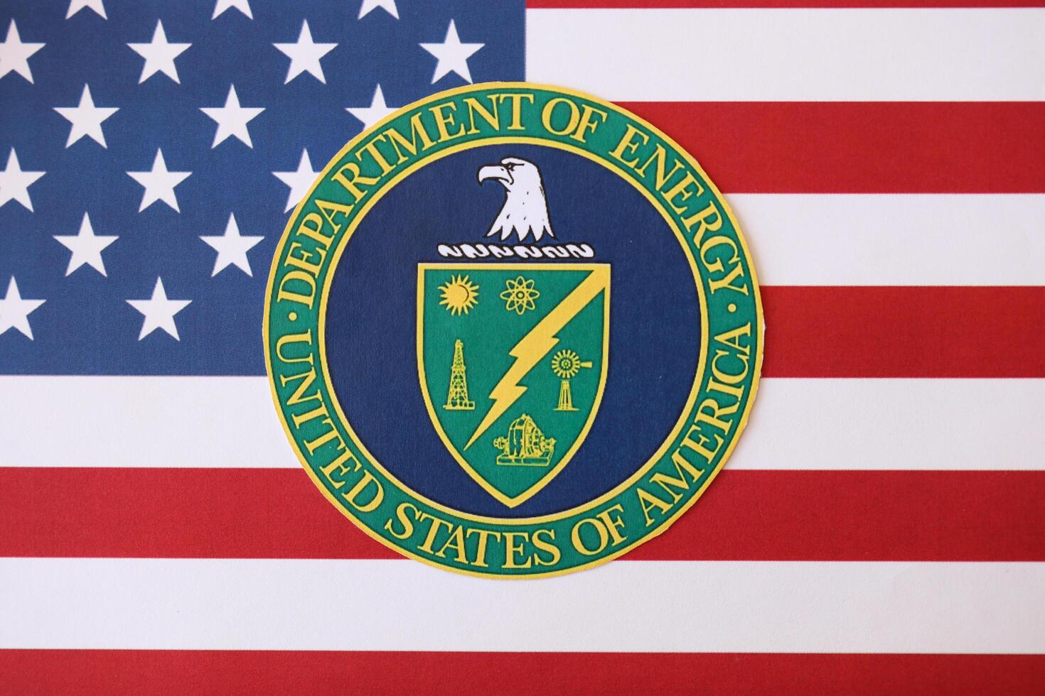 KYIV, UKRAINE - MARCH 9, 2024 US Department of Energy seal on United States of America flag photo