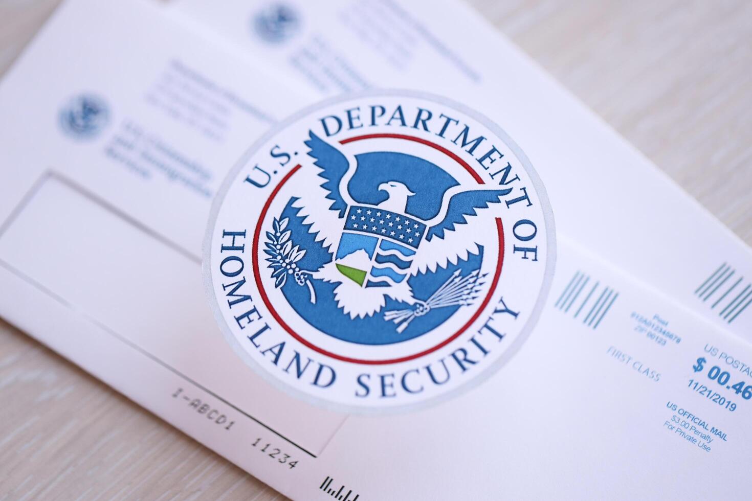 KYIV, UKRAINE - MARCH 9, 2024 US Department of Homeland Security seal on USCIS mail envelope photo