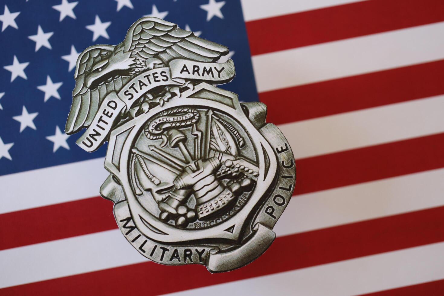 KYIV, UKRAINE - MARCH 9, 2024 US Army Military Police badge on United States of America flag photo