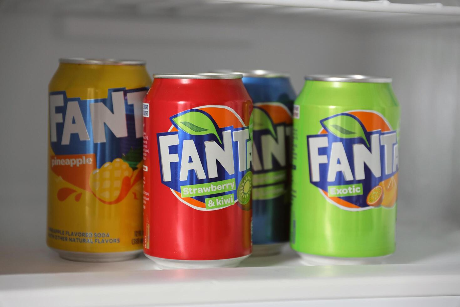 KYIV, UKRAINE - 4 MAY, 2023 Fanta soft drink brand tin cans with various flavours photo