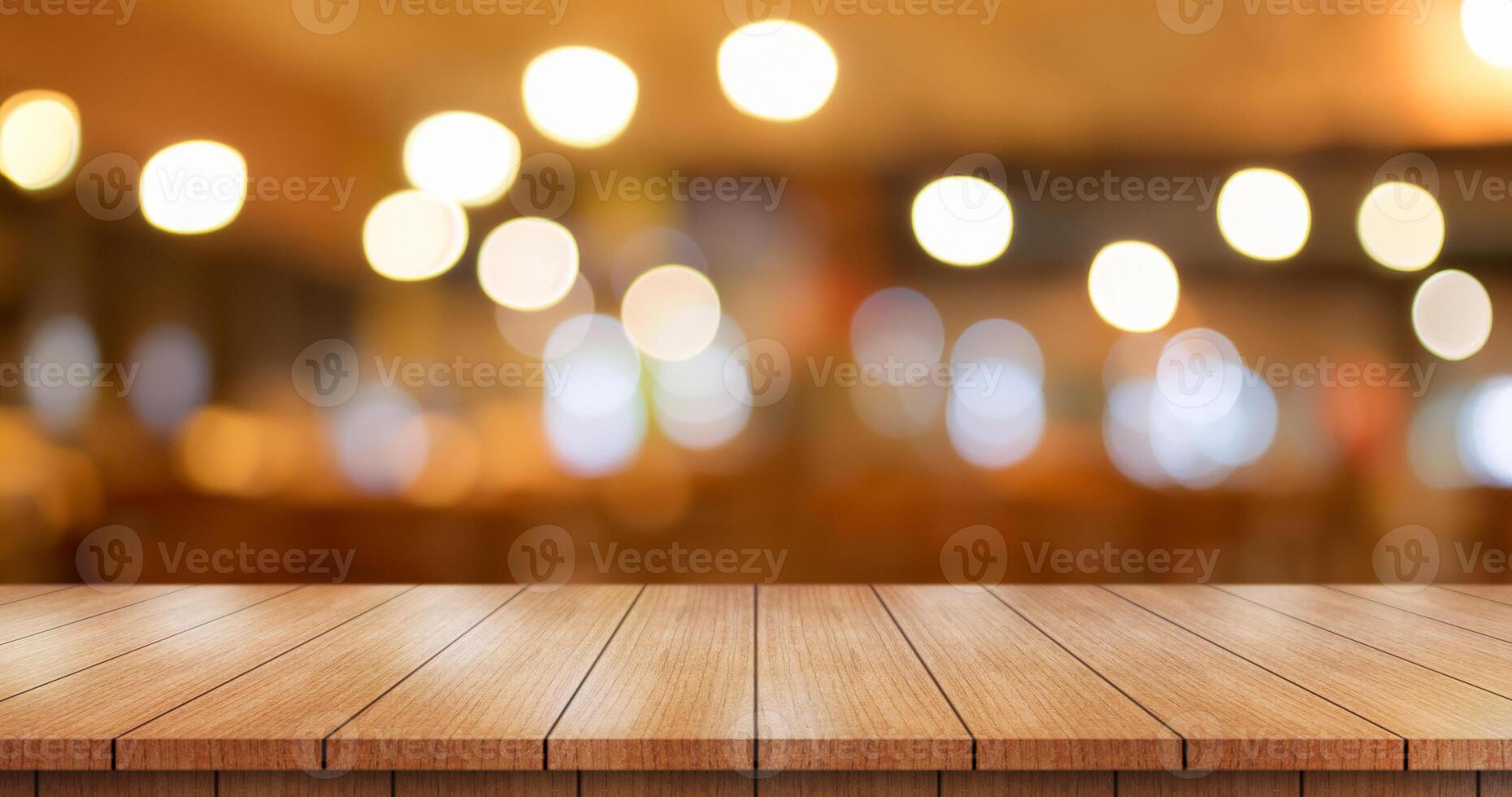 Empty wooden table top with lights bokeh on blur restaurant background. photo