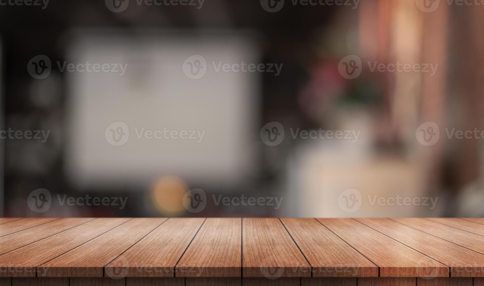 Empty wooden table top with lights bokeh on blur restaurant background. photo