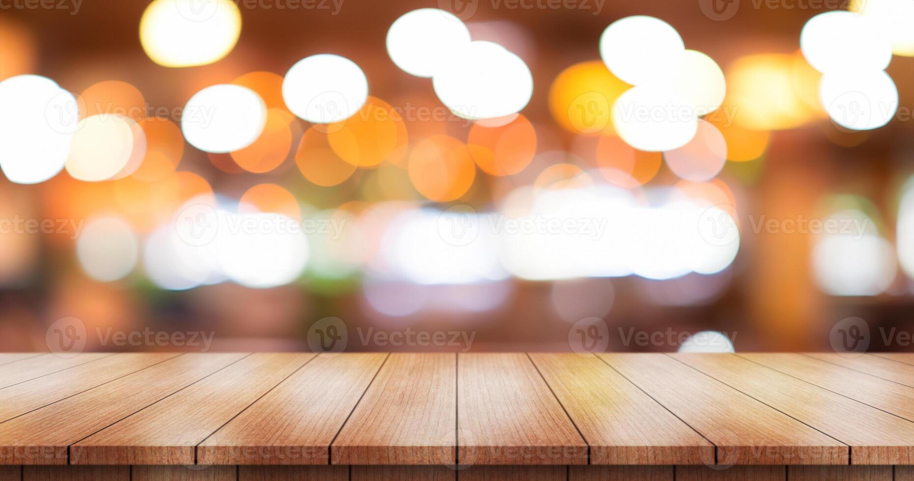 Empty wooden table top with lights bokeh on blur restaurant background. photo