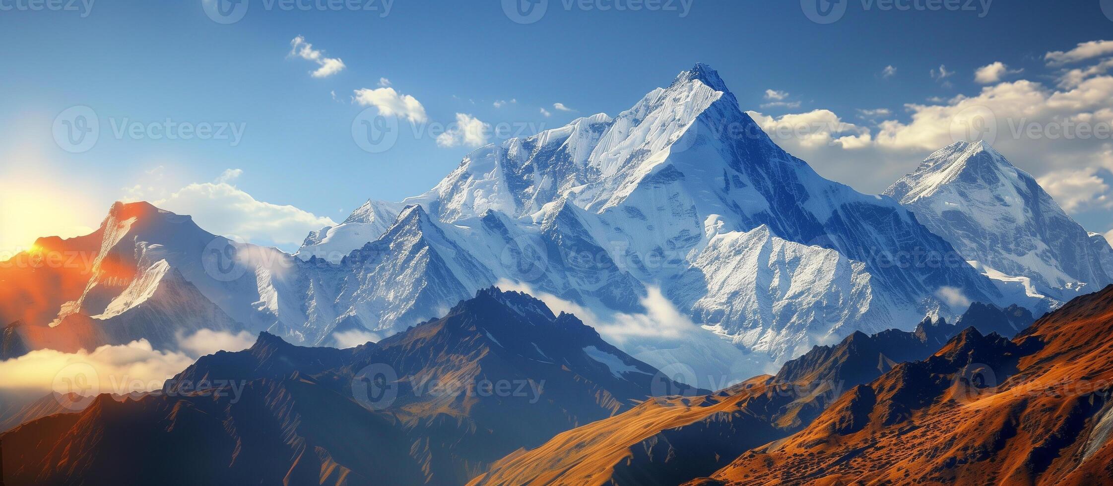 breathtaking mountain landscape, rocky peaks stand tall against the sky, nature's beauty shines brightly, with snowy mountaintops sparkling in the sunlight photo