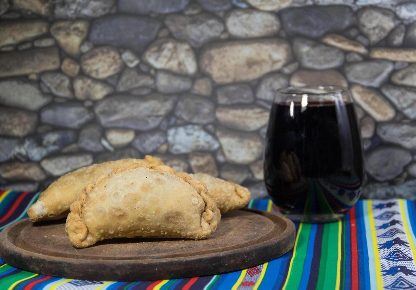 Northern empanadas, meat fries and a glass of red wine. Argentine gastronomy photo