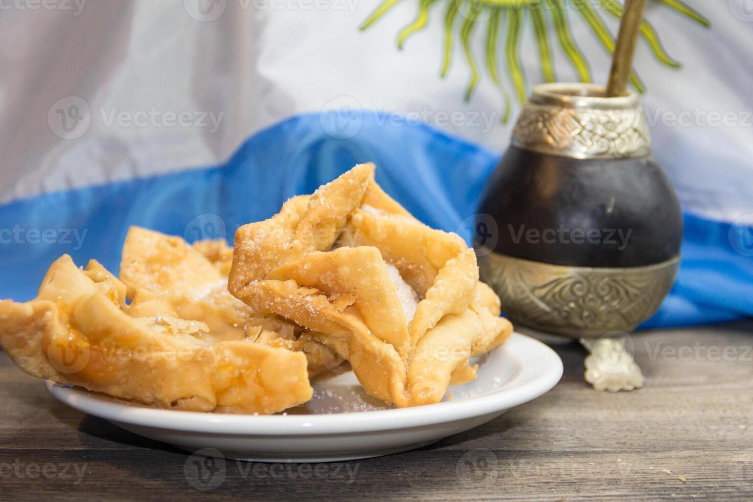 yerba mate, guitar and fried pastries, symbols of the Argentine tradition photo