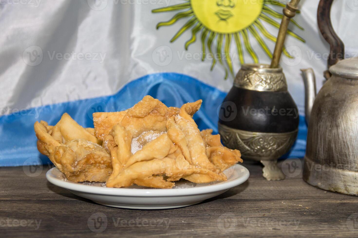yerba mate, guitar and fried pastries, symbols of the Argentine tradition photo