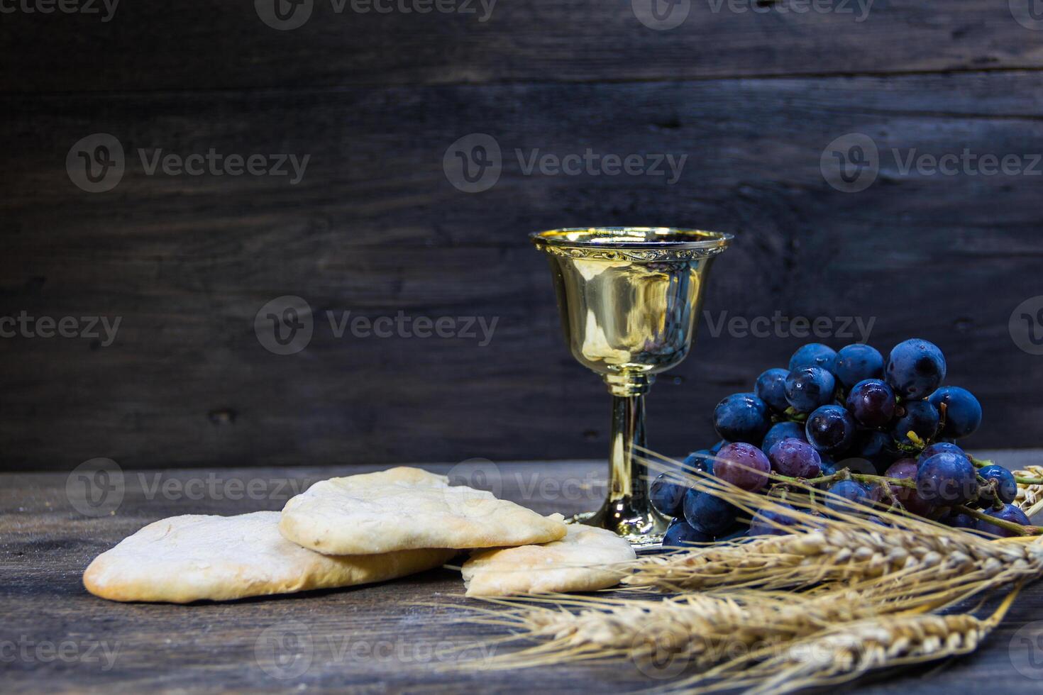 sour bread, wine, grapes and wheat symbol of Christian communion photo