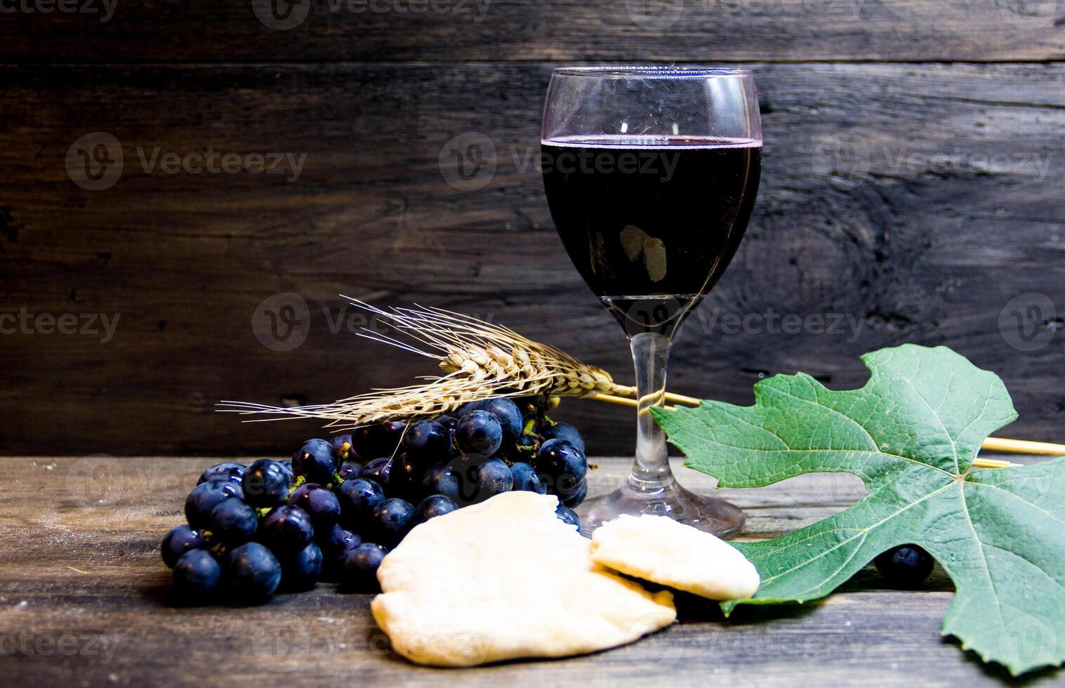 sour bread, wine, grapes and wheat symbol of Christian communion photo