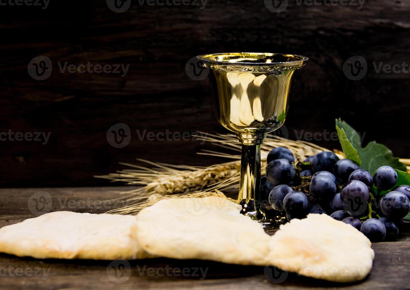 sour bread, wine, grapes and wheat symbol of Christian communion photo