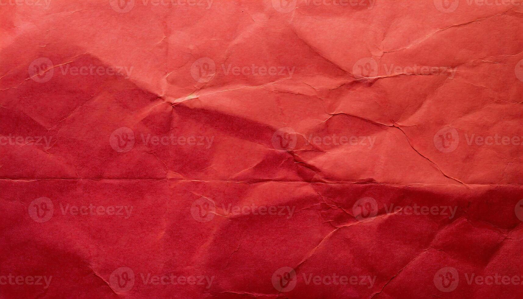 a red crumpled paper texture with a small hole photo