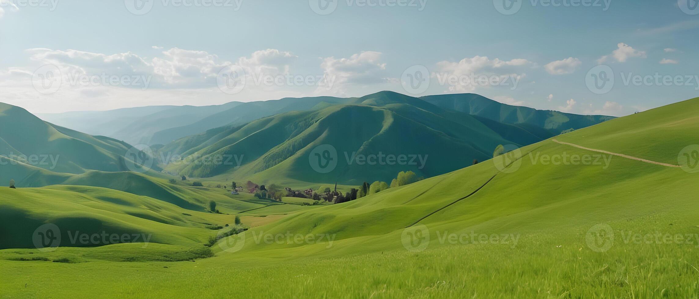 Panorama of beautiful countryside. Wonderful springtime landscape in mountains. Grassy field and rolling hills. Rural scenery photo