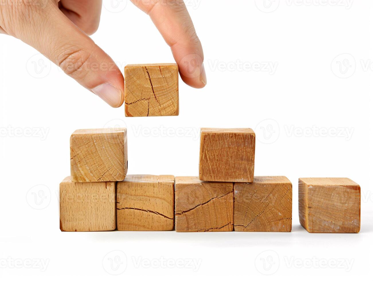 Hand putting and stacking blank wooden cubes on table with copy space can add text or icon photo