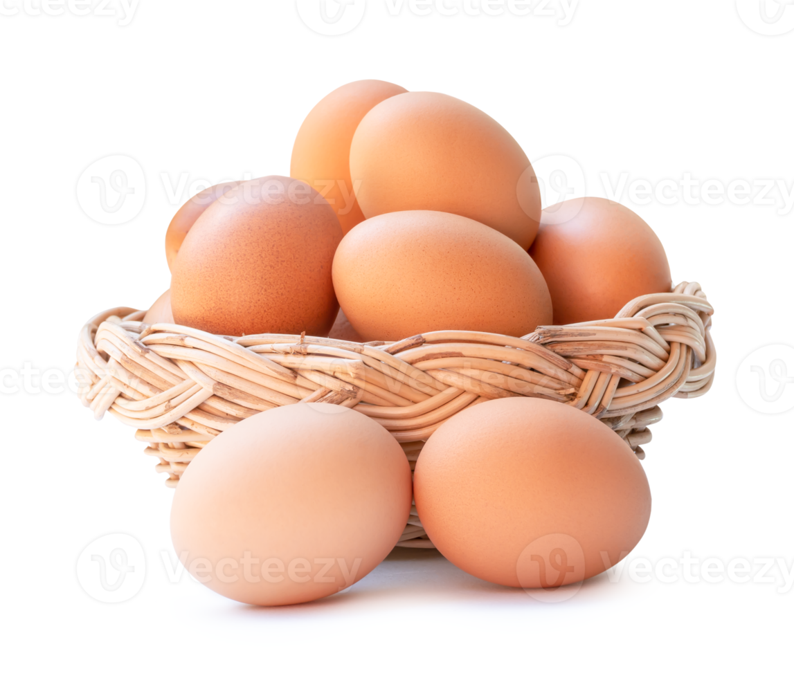 Front view of fresh brown chicken eggs in stack in woven bamboo basket isolated with clipping path and shadow in file format png