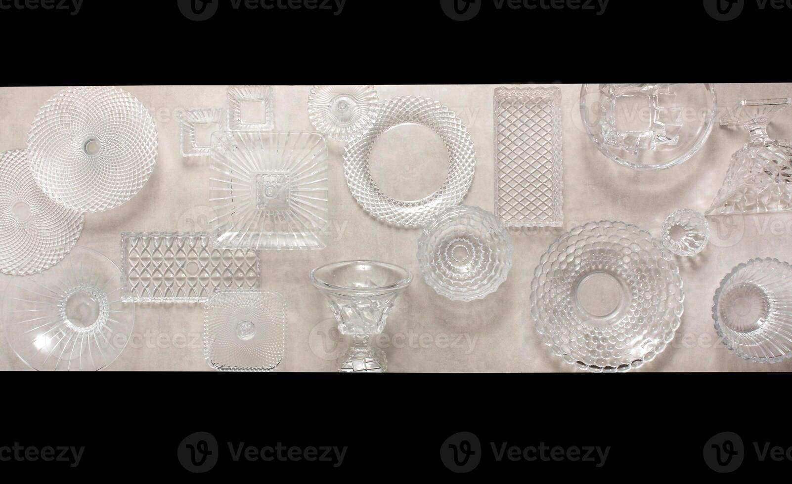 glasses, platters, bowls and kitchen objects seen from above on the table photo