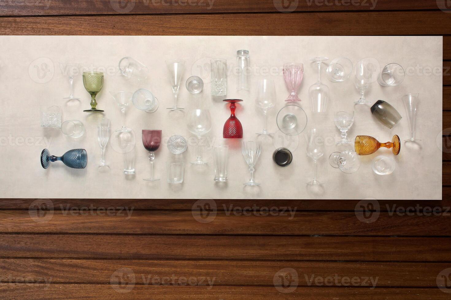 glasses, platters, bowls and kitchen objects seen from above on the table photo