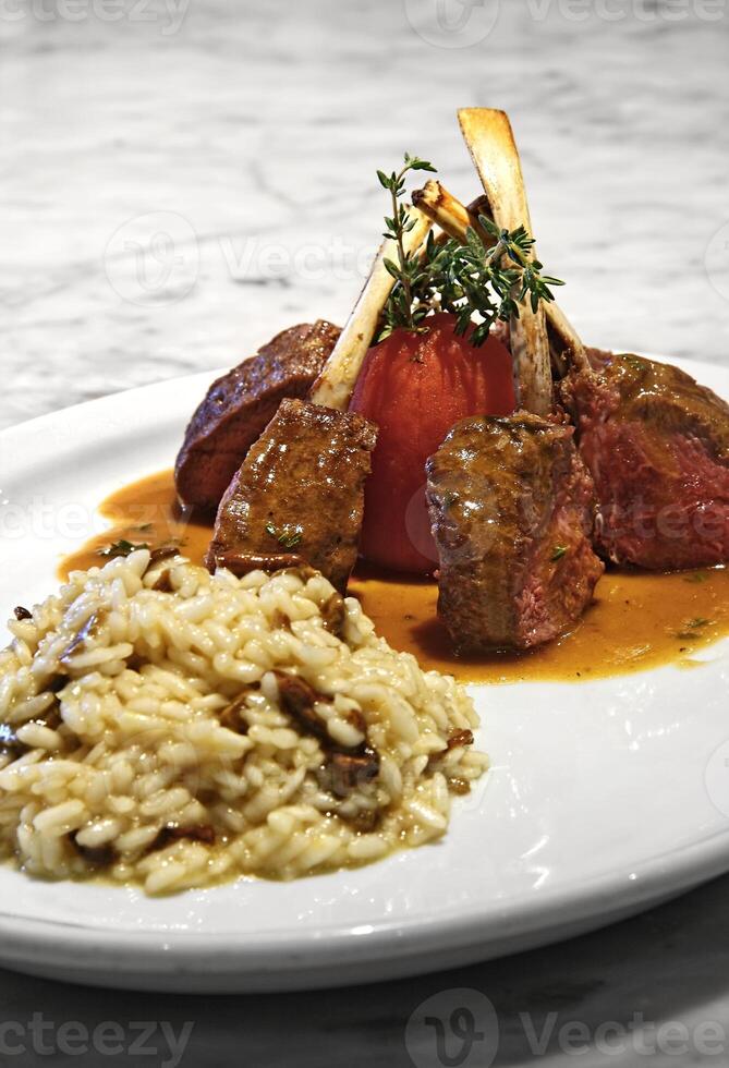 lamb with tomato and mushroom risotto photo