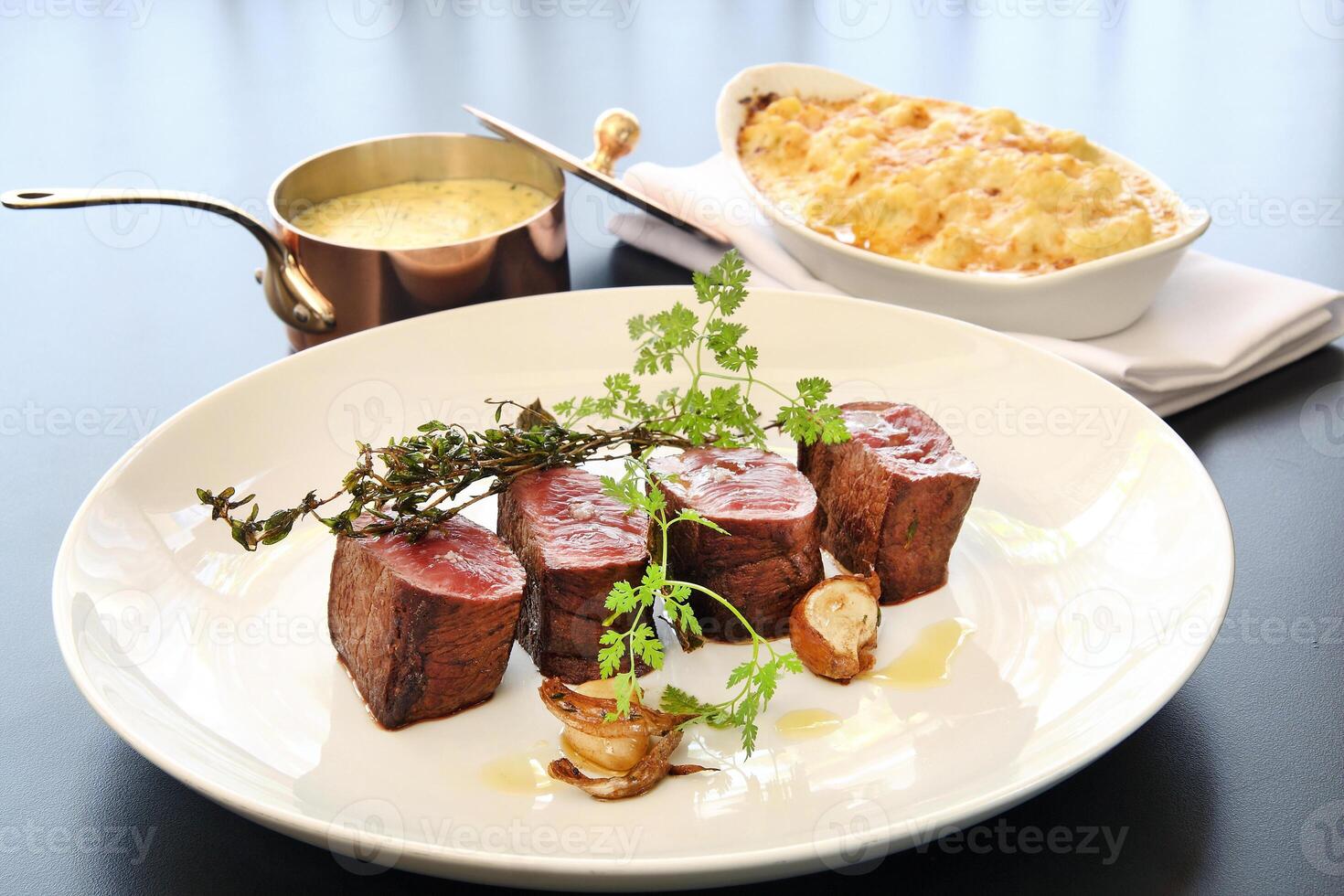 Rump tip with bernaise sauce on plate photo